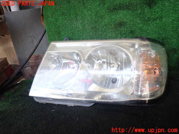 1UPJ-19581132]ランクル100系(UZJ100W)左ヘッドライト ハロゲン 【ジャンク】_m0001.jpg