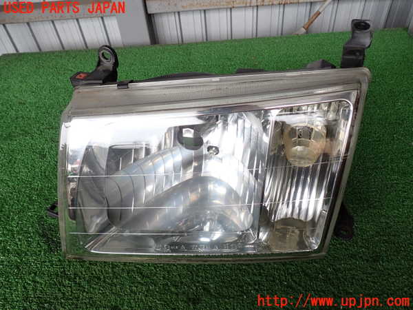 2UPJ-29901132]ランクル100系(UZJ100W)左ヘッドライト ハロゲン 【ジャンク品】 中古_m0001.jpg