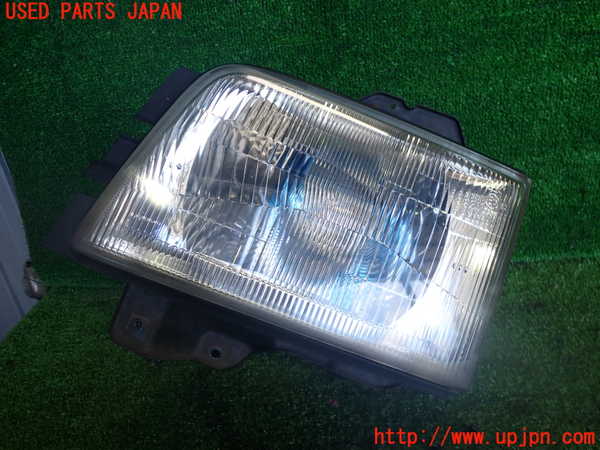 2UPJ-36551132]ビッグホーン(UBS73GW)左ヘッドライト ハロゲン 中古_m0001.jpg