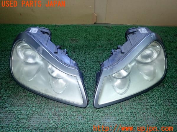 3UPJ=25900561]ポルシェ カイエン ターボ(9PAM4851A 957型)純正 7L5.941.031.J 7L5.941.032.J ヘッドライト 社外 リムカバー付き 中古_m0