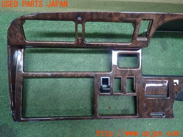 3UPJ=27890632]ハイエースワゴン(KZH106W)純正 木目調パネル メーター・オーディオパネル 中古_m1